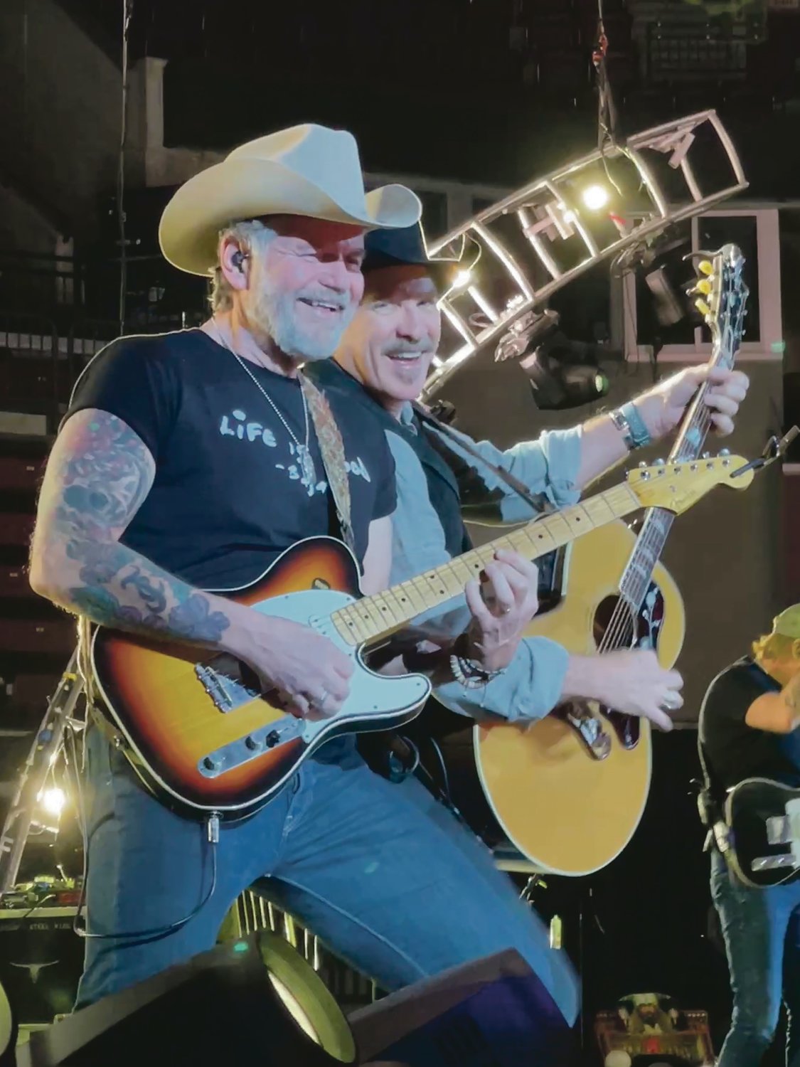 Kix Brooks and a member of the band put on smiles and jammed out as the crowd sang along to the decades of hits.