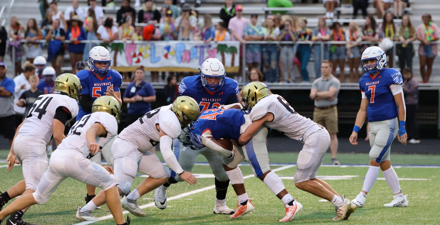Preston Ellingson (6) and Gunner Williams (52) combine for a tackle against the Hillcrest Hornets.